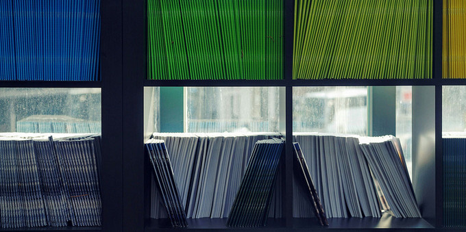 A stock image of colourful magazines on shelves.